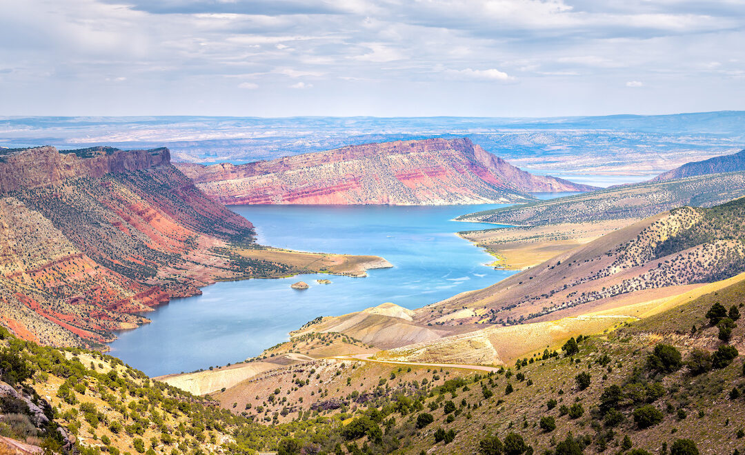 Panoramic view of Sheep Creek Overlook in Manila, Utah near Flaming Gorge National Park with clouds valley and river